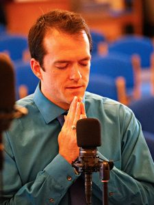 Keshava Betts prays with folded hands.